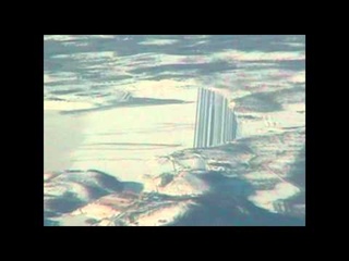 Very strange structure in mountains filmed from plane.