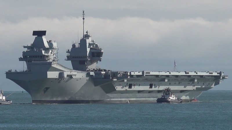 HMS Queen Elizabeth returns from US with armed escort You