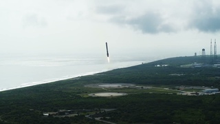 SpaceX Falcon Heavy’s side boosters landing back on Earth after launching Psyche spacecraft to orbit